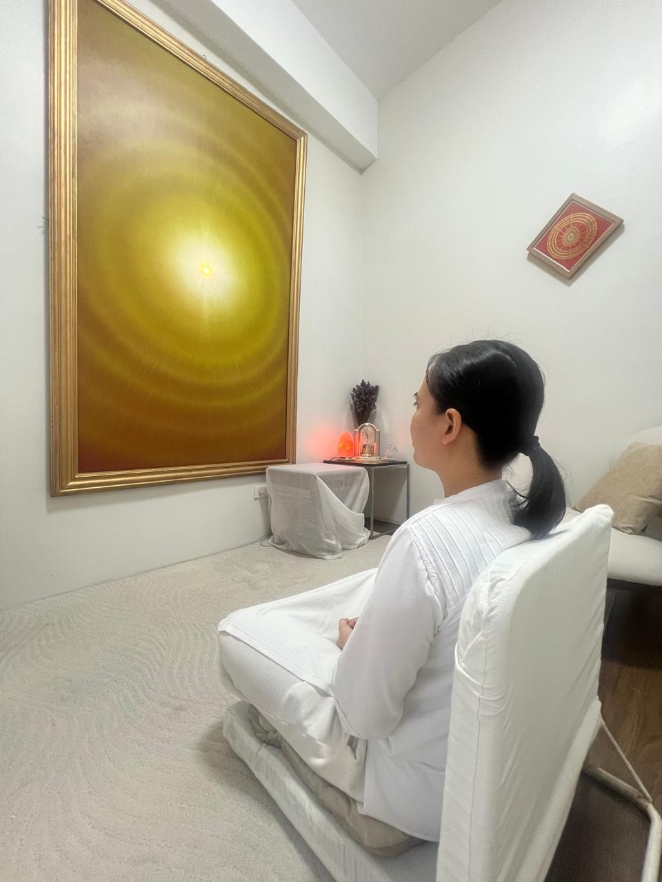 Meditating woman with a shining light at the mind area